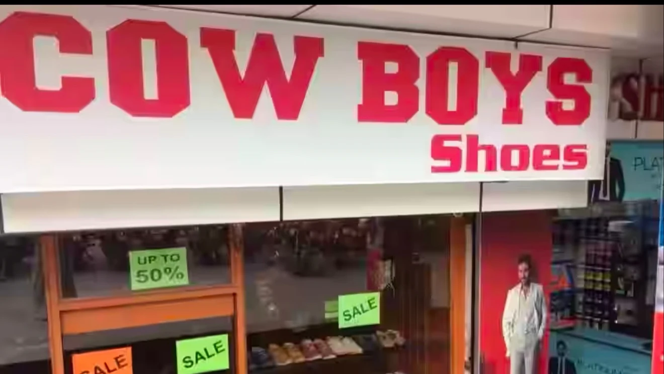 Cow Boys Shoes signboard in daylight